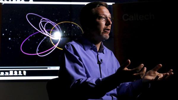 professor-of-planetary-astronomy-mike-brown-speaks-in-front-of-a-computer-simulation-of-the-probable-orbit-of-planet-nine-at-the-california-institute-of-technology-in-pasadena-california_5501427